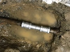 repaired-pipe-with-metal-sleeve